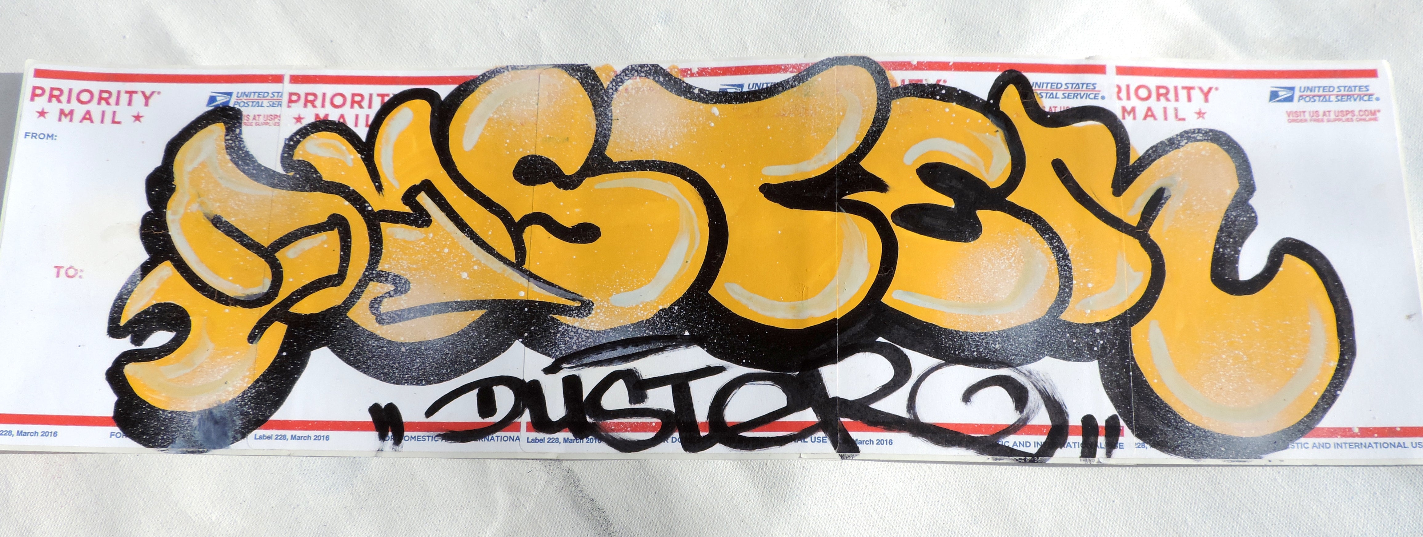 Original Yellow Duster Throwie on USPS Sticker Paper - 009